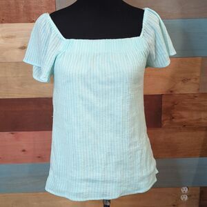 Medium 100% cotton. Super soft off shoulder blouse